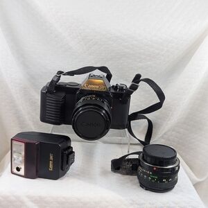 Vintage Canon T50 With Accessories And Polaroid Case